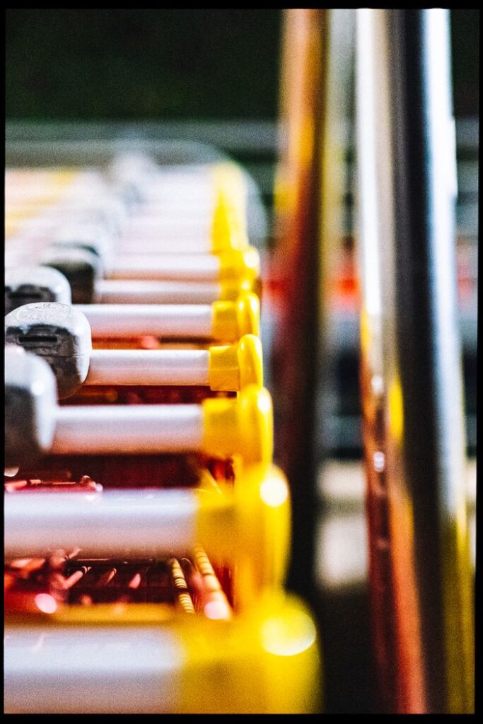 Close-up view of colorful shopping carts in a row, illustrating retail shopping concepts.